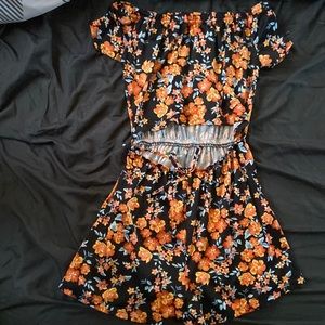 I am selling this beautiful multicolored romper. IT is a size M